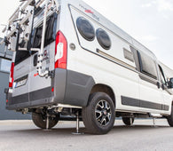 Motorhome with levelling system deployed